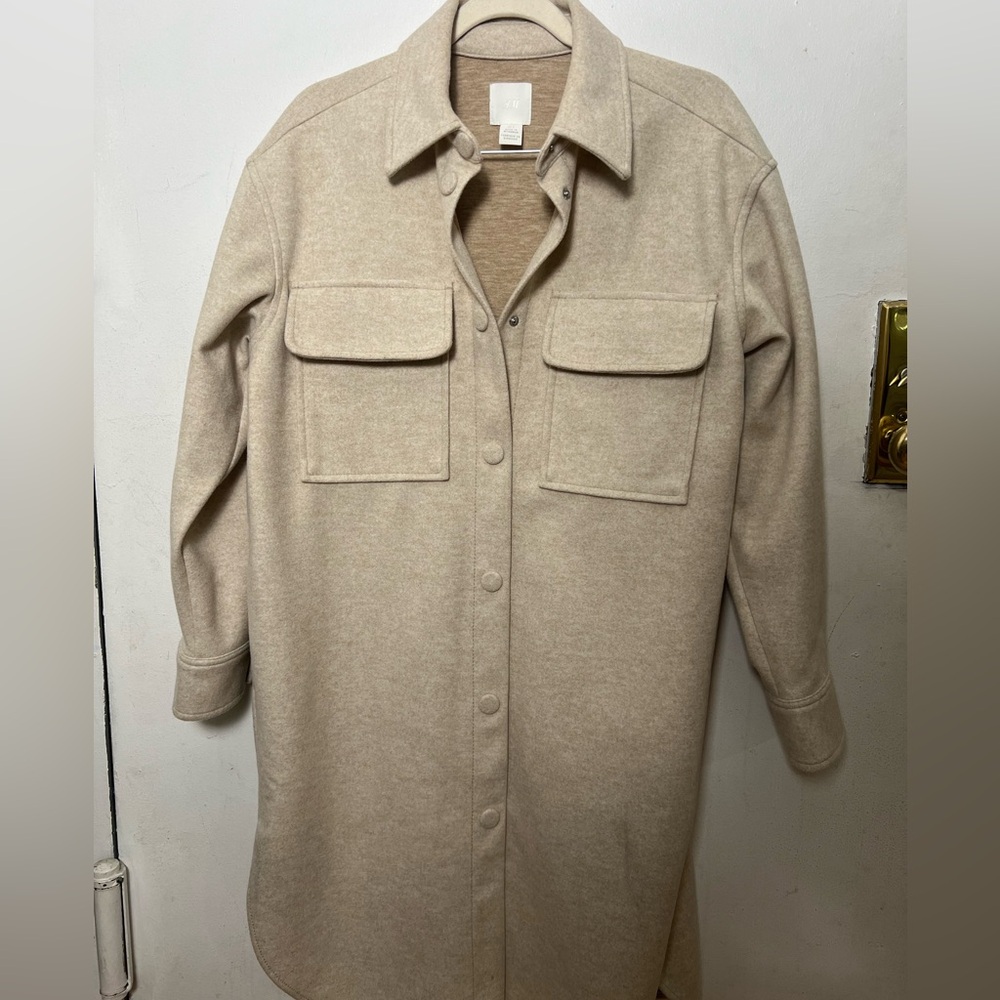 Women's Beige oversized Shacket. Button closure and has pockets